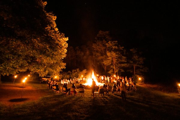 Image of a group gathered around a campfire
